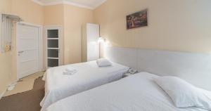 Postel nebo postele na pokoji v ubytování light hotel & hub