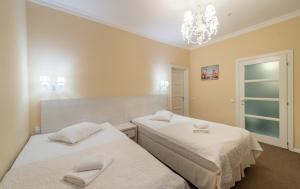 Postel nebo postele na pokoji v ubytování light hotel & hub