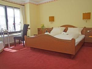 Postel nebo postele na pokoji v ubytování Hotel Beller
