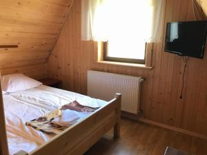 Łóżko lub łóżka w pokoju w obiekcie Dom Wypoczynkowy Grań