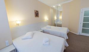 Postel nebo postele na pokoji v ubytování light hotel & hub