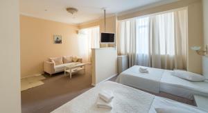 Postel nebo postele na pokoji v ubytování light hotel & hub
