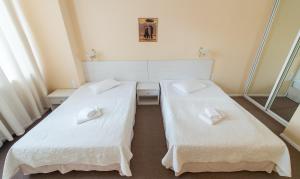 Postel nebo postele na pokoji v ubytování light hotel & hub