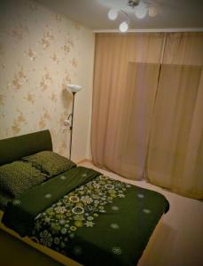 Кровать или кровати в номере Apartment on Lomonosova 29