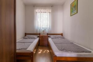 Apartments Miler tesisinde bir odada yatak veya yataklar