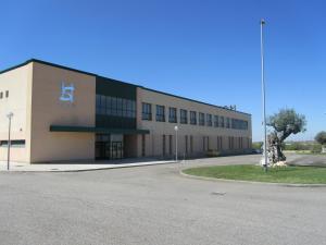 a large building with a sign on the side of it at Sommelier Hostelera SL in Fonolleres