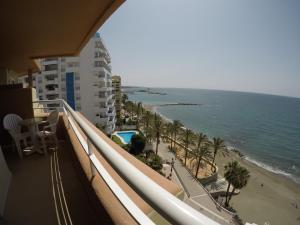 a view of the beach from the balcony of a building at Ona Princesa Playa in Marbella