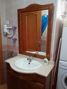 a bathroom with a sink and a mirror at Casa Dulce in Gran Tarajal