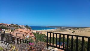 a view of a beach from a balcony at Dodo's House in Torre Dei Corsari