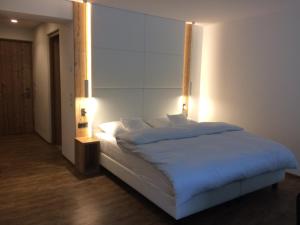 Postel nebo postele na pokoji v ubytování Hotel Stocker