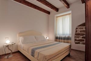 Llit o llits en una habitació de Agriturismo Casale Degli Ulivi Alghero