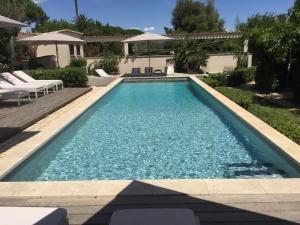 a swimming pool in the backyard of a house at Villa La Begude in Saint-Tropez