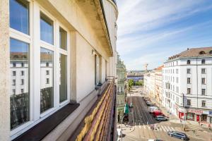 an apartment balcony with a view of a city at Top Wenceslas Square Apartment in Prague