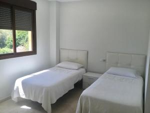 Posteľ alebo postele v izbe v ubytovaní Apartment Terrazas de Costalita