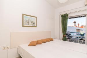 Postel nebo postele na pokoji v ubytování Alexger Gerakini Beach house view