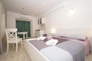 Posteľ alebo postele v izbe v ubytovaní Confluence Apartments