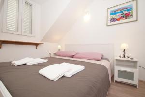 Posteľ alebo postele v izbe v ubytovaní Confluence Apartments