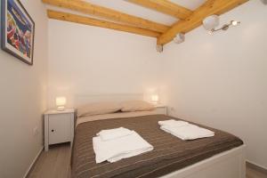 Posteľ alebo postele v izbe v ubytovaní Confluence Apartments