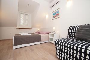 Posteľ alebo postele v izbe v ubytovaní Confluence Apartments