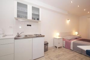 Posteľ alebo postele v izbe v ubytovaní Confluence Apartments