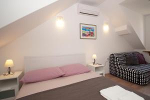 Posteľ alebo postele v izbe v ubytovaní Confluence Apartments