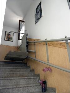 a staircase in a building with a person on the wall at Alla Basilica in Aquiléia