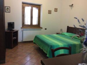 A bed or beds in a room at Agriturismo Il Morello