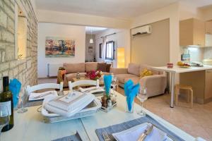 a living room with a couch and a table at Villa Kiki Paxos Ozias in Gaios +40 photos