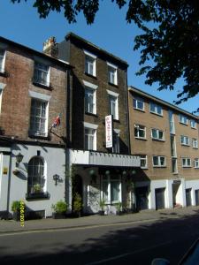 a large brick building on the side of a street at St Martins Guest House in Dover