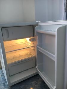 an open refrigerator with its door open and itsartmentsearch at Sarievi Holiday Home in Tsarevo