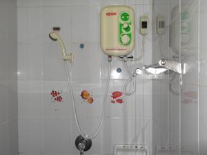 a shower with aitizer on the wall of a bathroom at Rim Ping Guest House in Chiang Mai +65 photos
