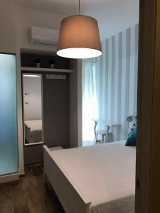 Postel nebo postele na pokoji v ubytování B&B Quasi in centro