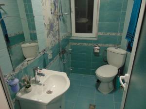 a bathroom with a toilet and a sink at Georgievi Guest House in Sapareva Banya +44 photos