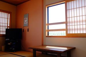 TV a/nebo společenská místnost v ubytování Mizuhokan