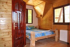 מיטה או מיטות בחדר ב-Rustic House