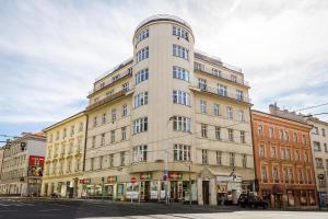 a tall building on the corner of a street at Top Wenceslas Square Apartment in Prague