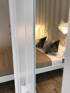 Postel nebo postele na pokoji v ubytování B&B Quasi in centro