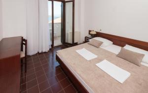Postel nebo postele na pokoji v ubytování Hotel Zenit Neum