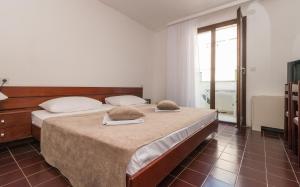 Postel nebo postele na pokoji v ubytování Hotel Zenit Neum