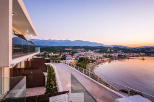 a view of the beach from a balcony of a house at Panorama+ in Almyrida