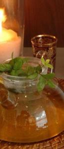 a vase with a plant in it on a table at Hotel South Charleroi Airport in Charleroi