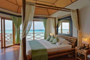 Uma cama ou camas num quarto em Safari Island