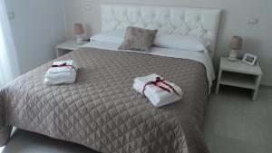 Posteľ alebo postele v izbe v ubytovaní Sassi Vacanze