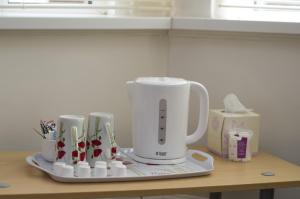 a white blender sitting on top of a counter at Pretoria Guest House in Bridlington +13 photos