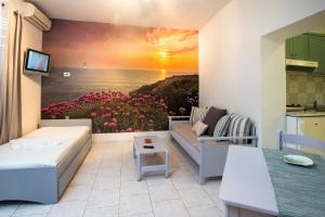 a living room with a painting on the wall at Balito in Kato Galatas