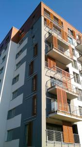 a tall building with balconies on the side of it at 1 Bedroom Francuska Park Apartment in Katowice