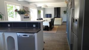 a kitchen with a counter and a dining room at La bastide de Lily in Séguret