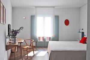 Voodi või voodid majutusasutuse Hotel Ayllon toas