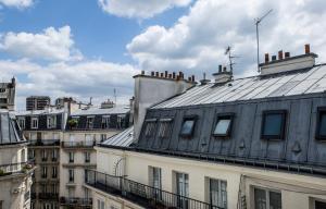 a view of roofs of buildings in a city at Hôtel Beaurepaire in Paris