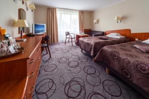 Postel nebo postele na pokoji v ubytování Hotel Lidia Spa & Wellness